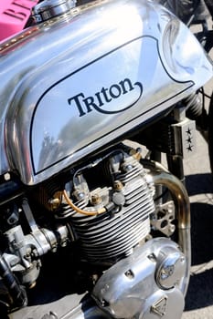 an old motorcycle triumph triton is a rare and sought after model made at the time by Triomph and Norton