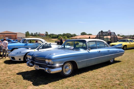 1958 Cadillac de Ville section shown in a vintage car rally