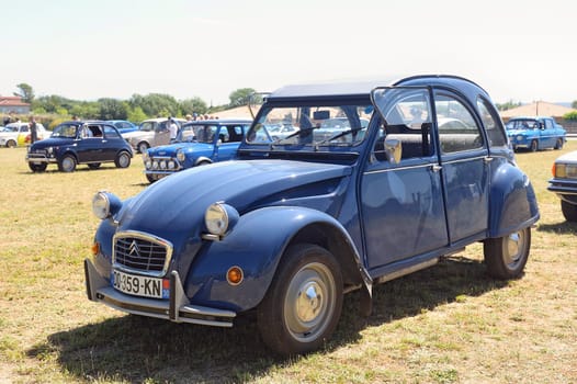 Citroen 2CV blue exhibited in a vintage car rally