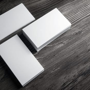Blank white business cards mockup on wood table background.