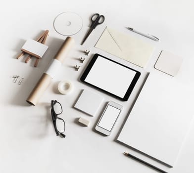 Corporate identity template. Photo of blank stationery set on white paper background.