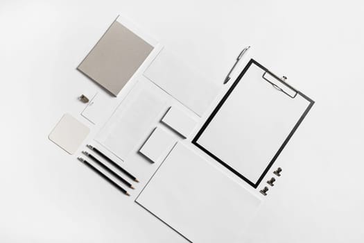 Photo of blank stationery set on paper background. Corporate identity mock up for placing your design. Top view.