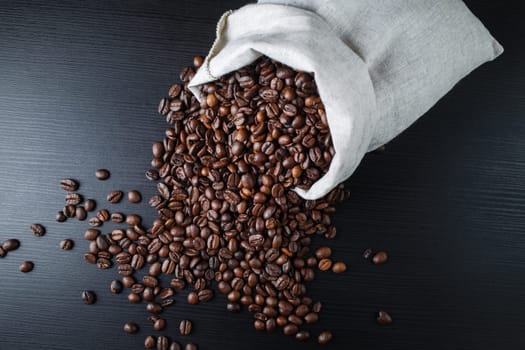 Roasted coffee beans and canvas bag. Top view.