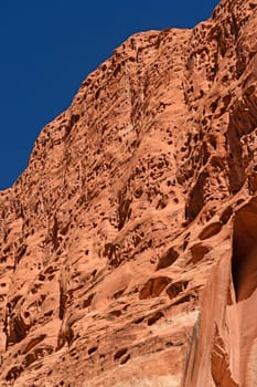Pockmarked Cliffs in a Red Rock Canyon in Capitol Reef National Park in Utah