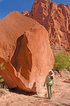 Looking up at Red Rock Boulder in Spring Canyon in Capitol Reef National Park in Utah