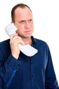 business man calling with big phone and looking grimly
