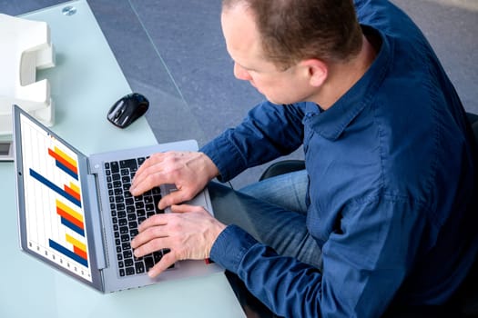 young business man at his desk working with computer