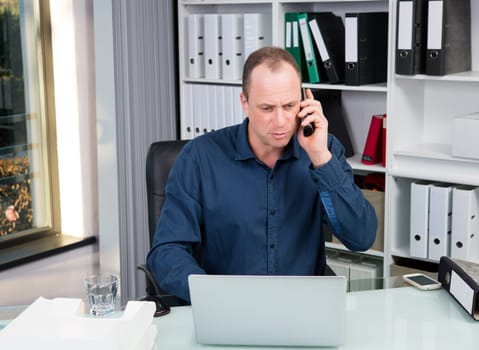 young business man at his desk working