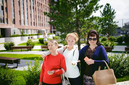 three women of different ages, family. grandmother, mother, daughter.