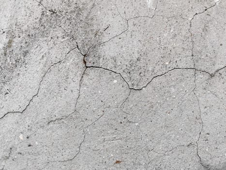 Old grey concrete wall background. Grungy texture.