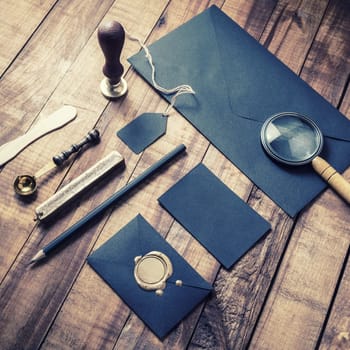 Black corporate stationery set. Blank branding identity template on vintage wooden background.