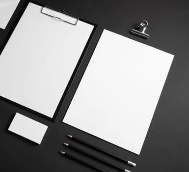 Blank stationery set on black paper background. Corporate identity template. ID mockup. Mock up for branding identity. Responsive design mockup.