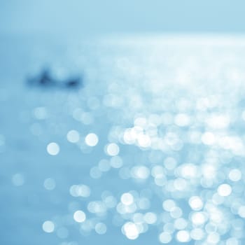 Abstract nature sea background - blurred kayaking on the sea at sunset