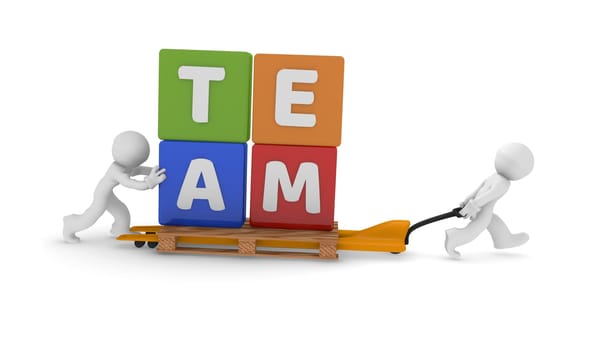 Teamwork concept with two 3d character and colorful dices with the word teamwork on a lifting cart, 3d rendering