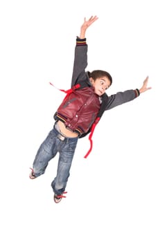 Young boy student jumping isolated in white