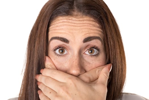 Stressed casual young woman isolated in a white background