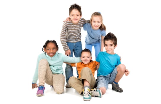 Group of happy children posing isolated in white