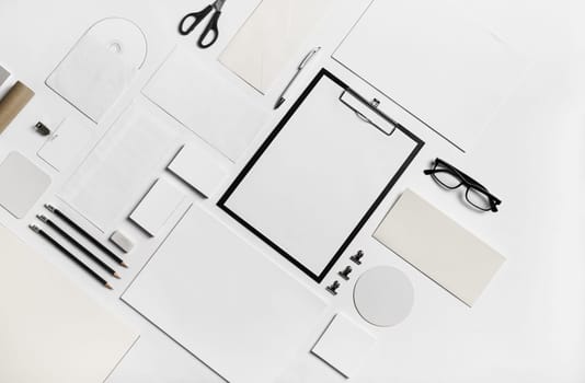 Photo of blank stationery set on paper background. Corporate identity mockup. Responsive design template. Flat lay.