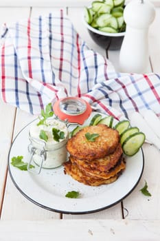 Fresh potato pancakes and cottage cheese with fresh herbs