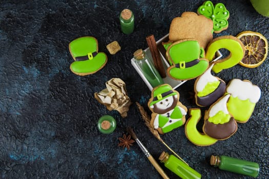 Gingerbreads cookies for Patrick's day on black concrete background