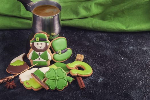 Gingerbreads for Patrick's day and on wooden background