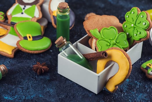 Gingerbreads cookies for Patrick's day on black concrete background