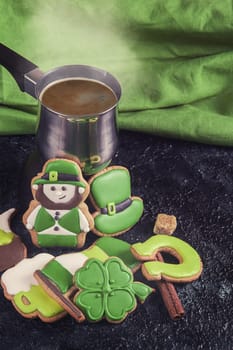 Gingerbreads for Patrick's day and on wooden background