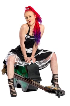 Rock'n'Roll singer with red hair sits on a double bass