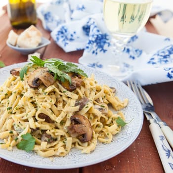 Taglietelle noodles with mushrooms and cream vinegar
