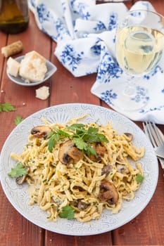 Taglietelle noodles with mushrooms and cream vinegar