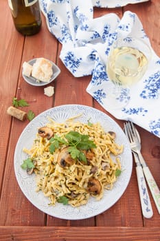 Taglietelle noodles with mushrooms and cream vinegar