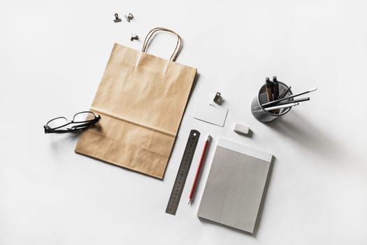 Photo of blank stationery set on white paper background. Mock up for placing your design. Responsive design mockup.
