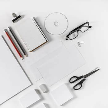 Brand identity template. Photo of blank corporate stationery set on white paper background.