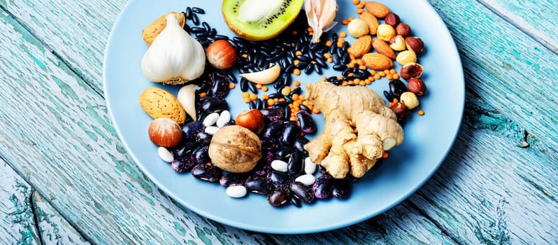 Healthy eating food concept with nut, spice, vegetables and fruit