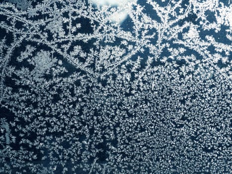 Frost pattern on a window, seasonal or winter background
