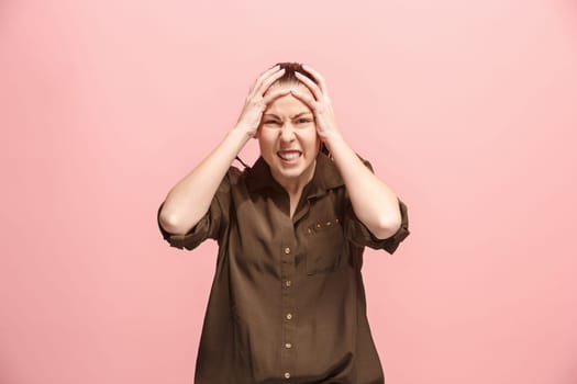 Why is that. Beautiful female half-length portrait isolated on trendy pink studio backgroud. Young emotional surprised, frustrated and bewildered woman. Human emotions, facial expression concept.