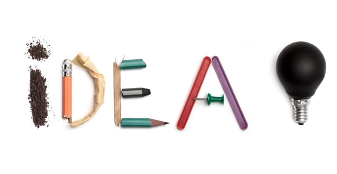 Concept of idea with colorful crumpled paper. The word Idea created from office stationery. The art, creative, letters concepts. Conceptual image. Top view, isolated on white desk. Work tool concept