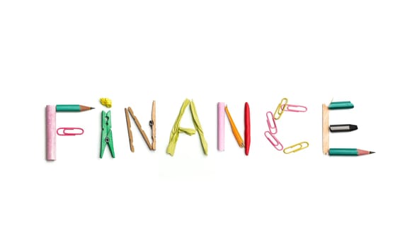 Concept of idea with colorful crumpled paper. The word finance created from office stationery. The art, creative, letters concepts. Conceptual image. Top view, isolated on white desk. Work tool concept