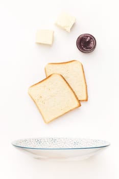 The falling ingredients of fried fried toastes. Healthy breakfast ingredients. Flying food