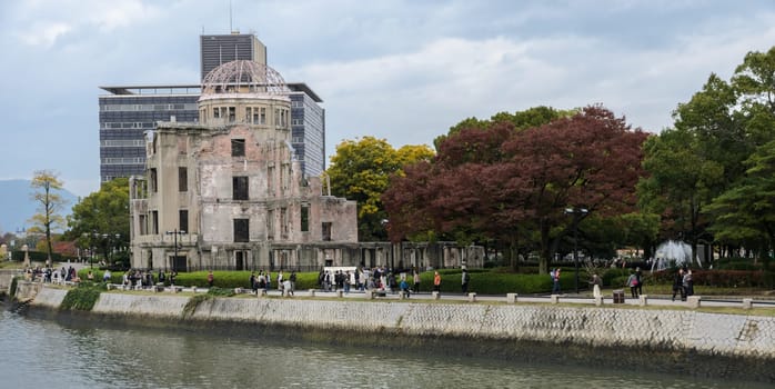 HIROSHIMA, JAPAN - NOVEMBER 19, 2016: Atomic bomb dome at Peace memorial park during autumn season in Hiroshima, Japan. Ruins of Hiroshima Prefectural Industrial Promotion Hall, UNESCO World Heritage Site