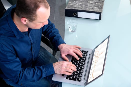 young business man at his desk working with computer