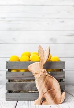 Traditional Easter holiday basket with a bunny and eggs