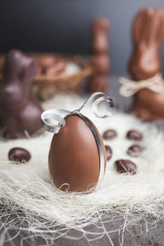 Delicious seasonal chocolate Easter egg with a ribbon