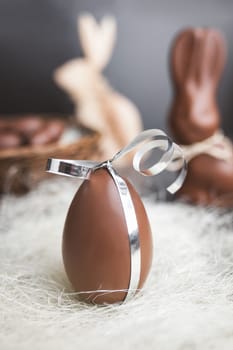Delicious seasonal chocolate Easter egg with a ribbon