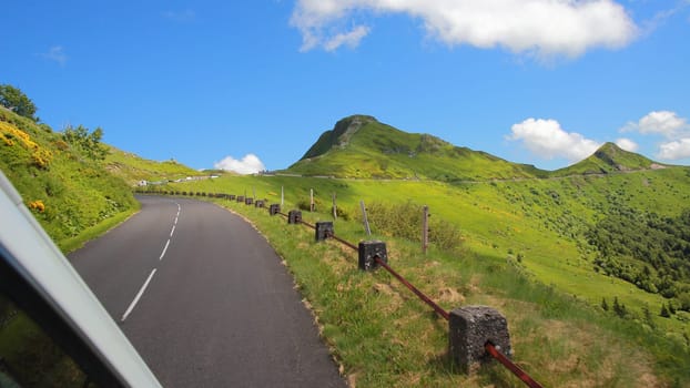 Driving on the road in Puy Mary, volcanic french mountains, Massif Central, France