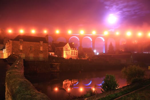 Night view of Dinan, medieval town on the Rance river. Dinan, Brittany, France.