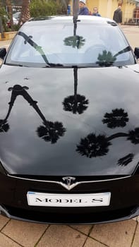 Menton, France - March 3, 2018: Black Tesla Model S (Front View) Electric Car Parked on a Square in Menton on The French Riviera. The Tesla Model S is a Luxury Full-Sized Electric Five Door
