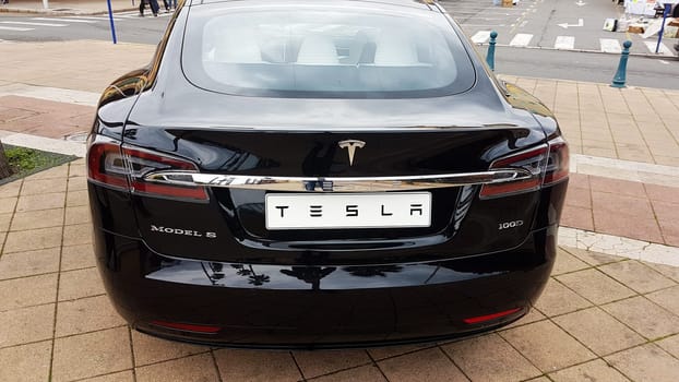 Menton, France - March 3, 2018: Black Tesla Model S (Rear View) Electric Car Parked on a Square in Menton on The French Riviera. The Tesla Model S is a Luxury Full-Sized Electric Five Door .
