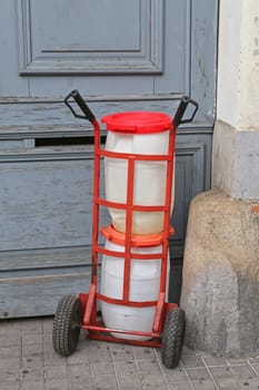 Two Plastic Barrels at Dolly Transport Delivery