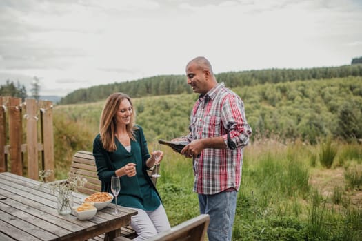 Husband and wife spending the weekend together, celebrating their anniversary with some champagne.